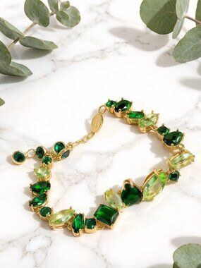 A brand-new Swarovski silver chain featuring green candy-shaped crystals